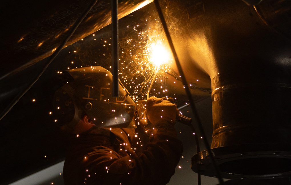 Welder working, with sparks flying