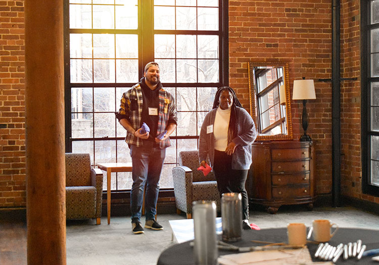 Man and woman talking at the company holiday party