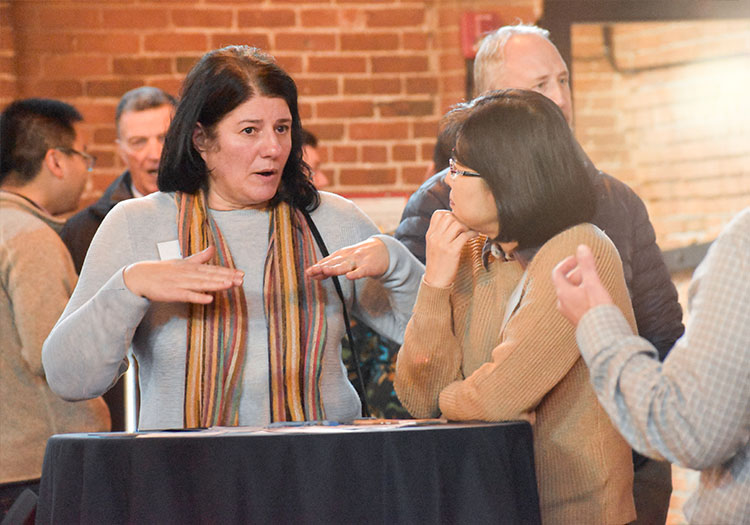 Two women talking at table